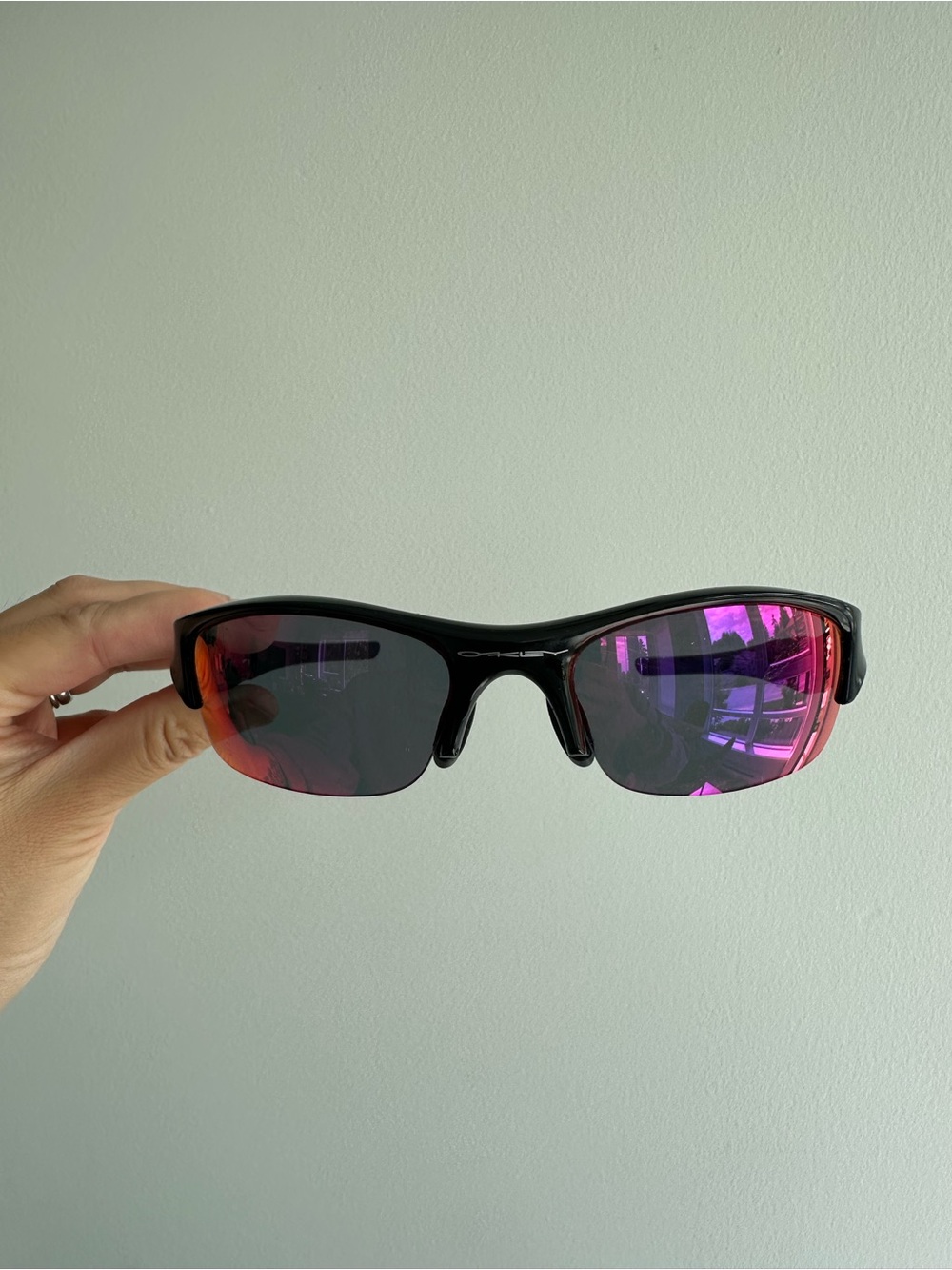 Oakley Black Frame Sunglasses with Pink-Red Mirrored Lenses